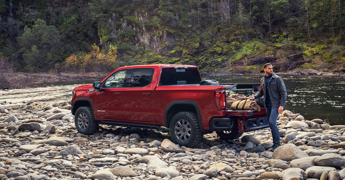 2026 GMC Sierra 1500 parked in a rocky terrain near water