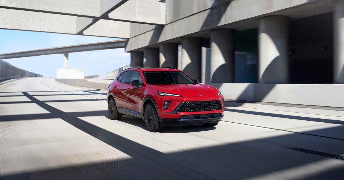 2026 buick envision in red under a building